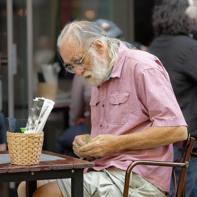 Elderly man sitting outside