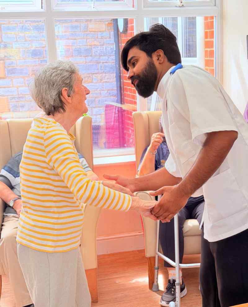 Resident dancing with carer