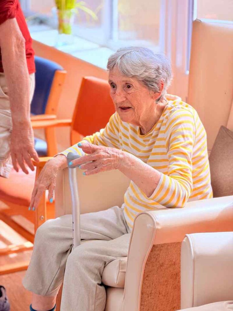 Resident sitting in chair