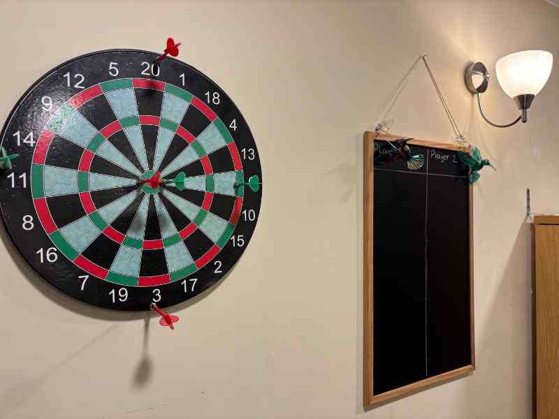 dartboard in the maccy arm at immacolata house care home in seaton