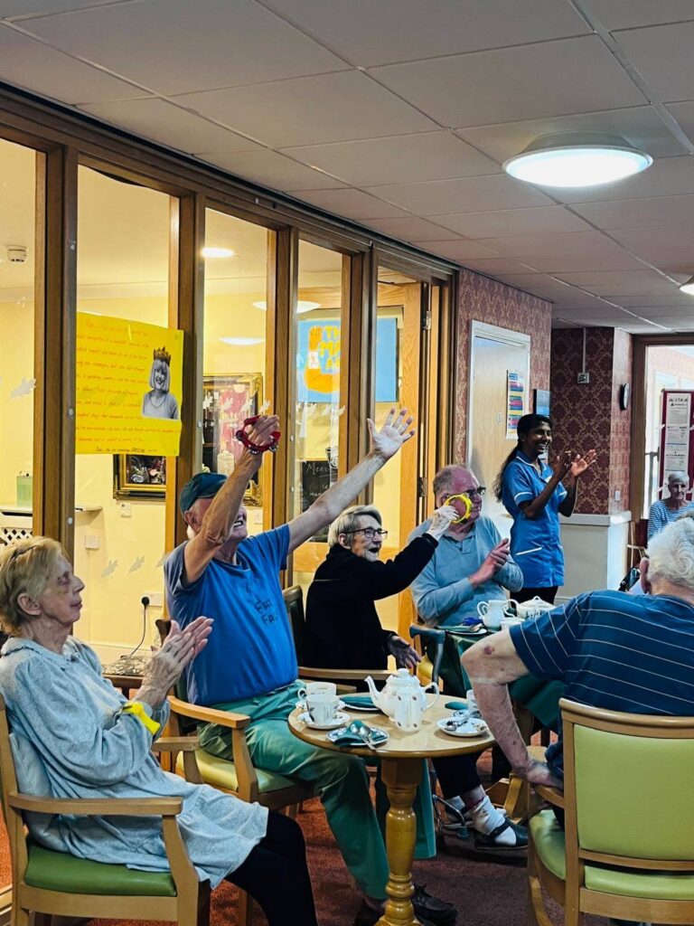 Residents and families socialising at the Immacolata House Dementia Café